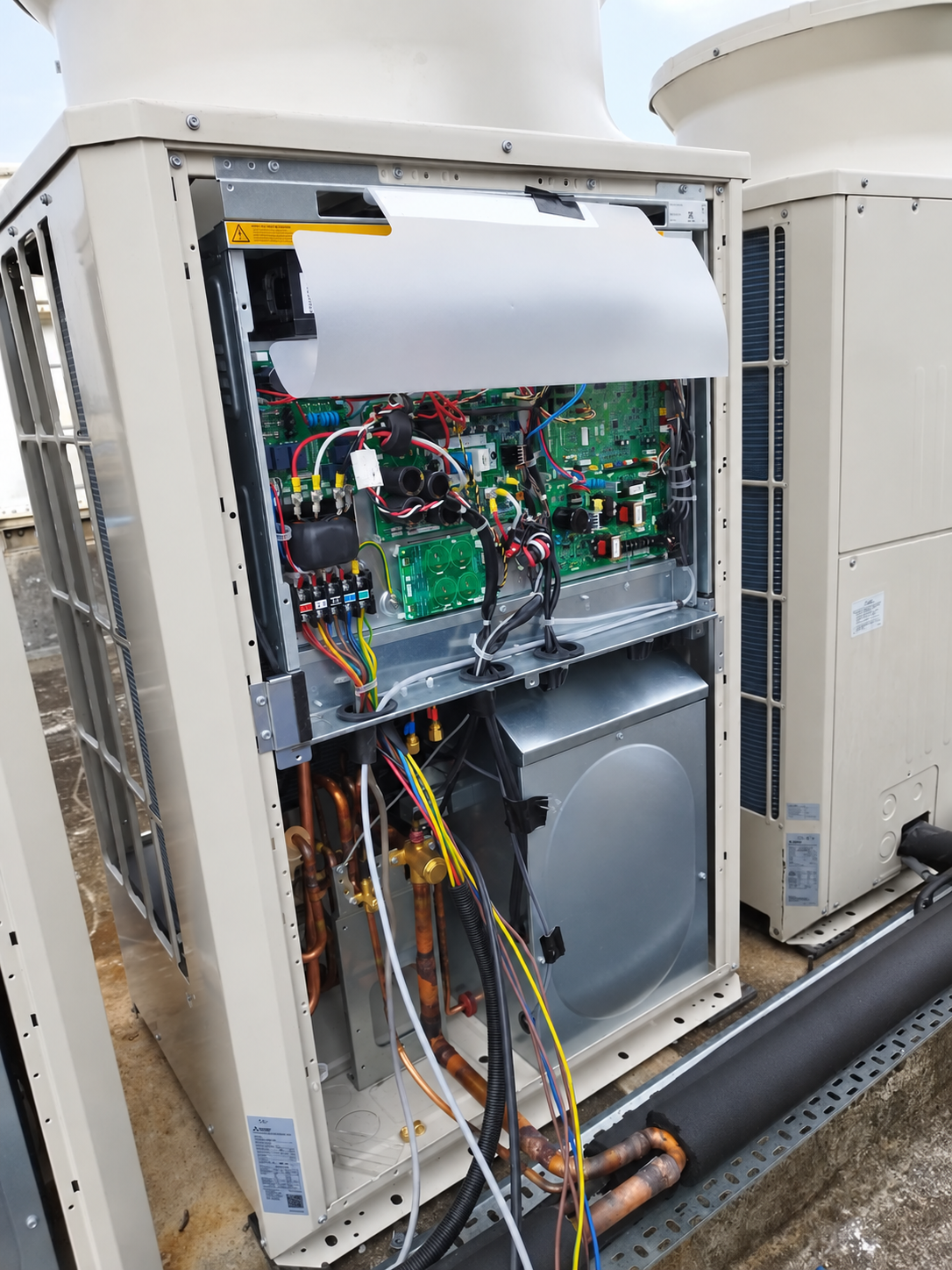 Commercial rooftop VRV condenser with exposed internal components