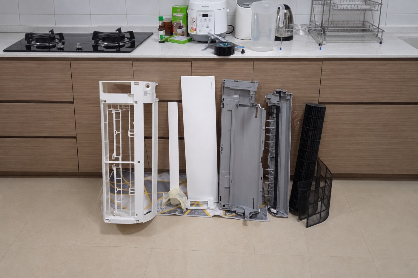 Disassembled aircon housing parts on a counter
